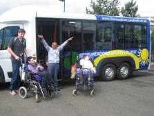 mellor bus with people in wheelchairs outside